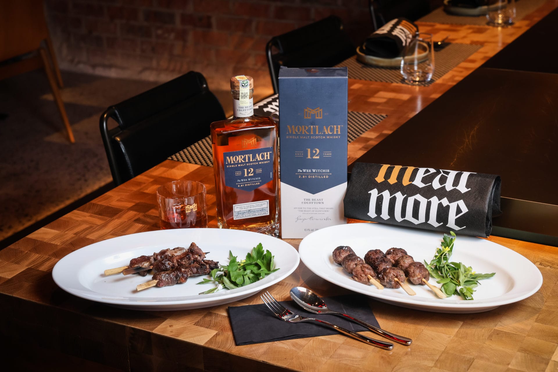 (l) wagyu hambagu skewer (r) usda prime dry age oyster blade paired with mortlach 12 yo