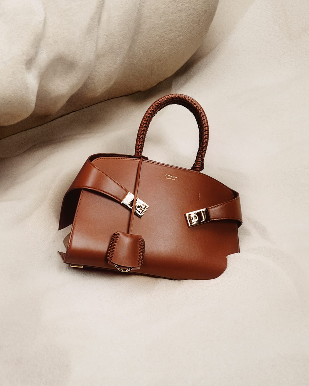 ferragamo pf24 main still life w cognac hug bag p3